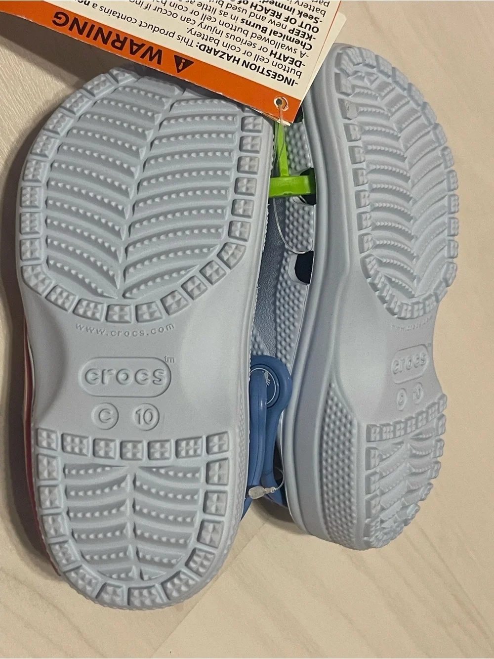 CROCS Kids Light Up Clogs with Blue Heel Straps and Multicolor Star Charms